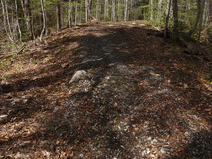 The Seventh Lake Mountain Trail, a class II community connector snowmobile trail,  includes where gravel has been applied to stabilize the trail surface like the stretch of trail pictured above. This is a design feature that is not used for foot trails.