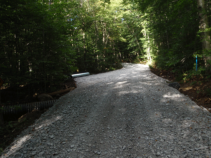 A newly reconstructed section of the Bear Creek Road in the Black River Wild Forest. The heavy use of gravel is unlike most Forest Preserve roads.