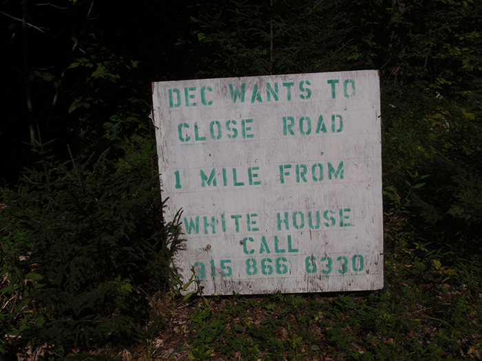 Sign on the Town of Wells section of the West River Road, advocating against close of the western .7 miles of road in the Silver Lake Wilderness Area.