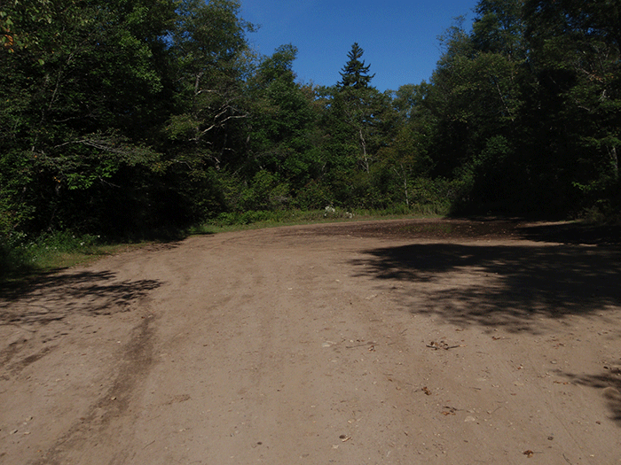 A large baseball field-size dead end turnabout at the end of the West River Road within the Silver Lake Wilderness Area.