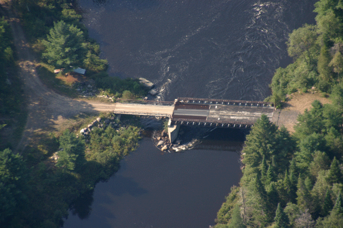 The Polaris Bridge will be retained under the new Essex Chain Complex Unit Management Plan, despite state laws that prohibit motorized uses in Scenic River corridors as this area in classified under the NYS Wild, Scenic, and Recreational Rivers Act. State agencies employed  unusual legal interpretations to authorize this bridge for public motor vehicle use on the Forest Preserve.