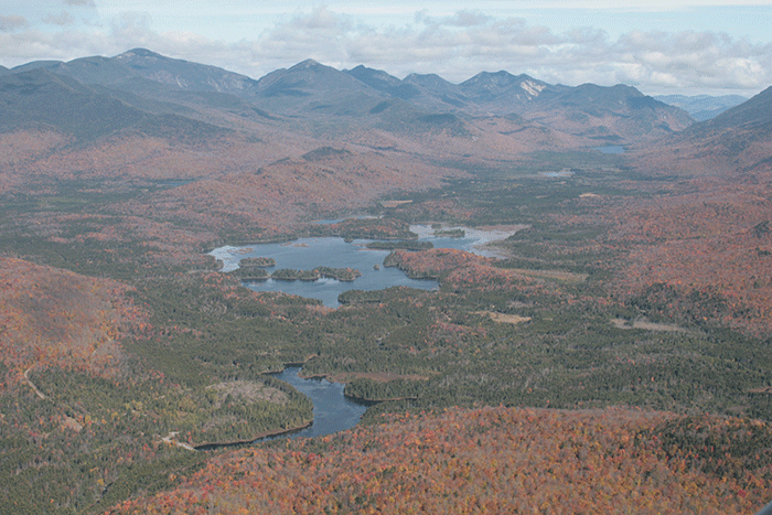 An aerial of the Boreas Ponds with the High Peaks in the background. PROTECT supports all the lands in the