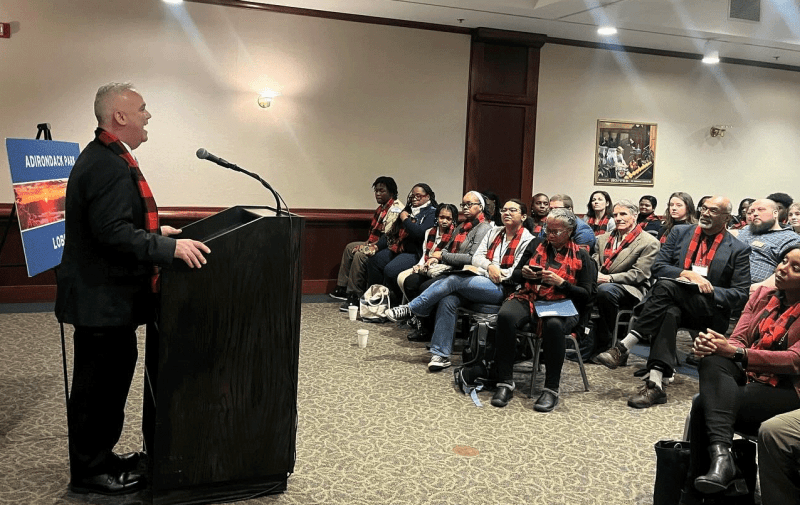 Assemblymember Matthew Simpson speaks to the group